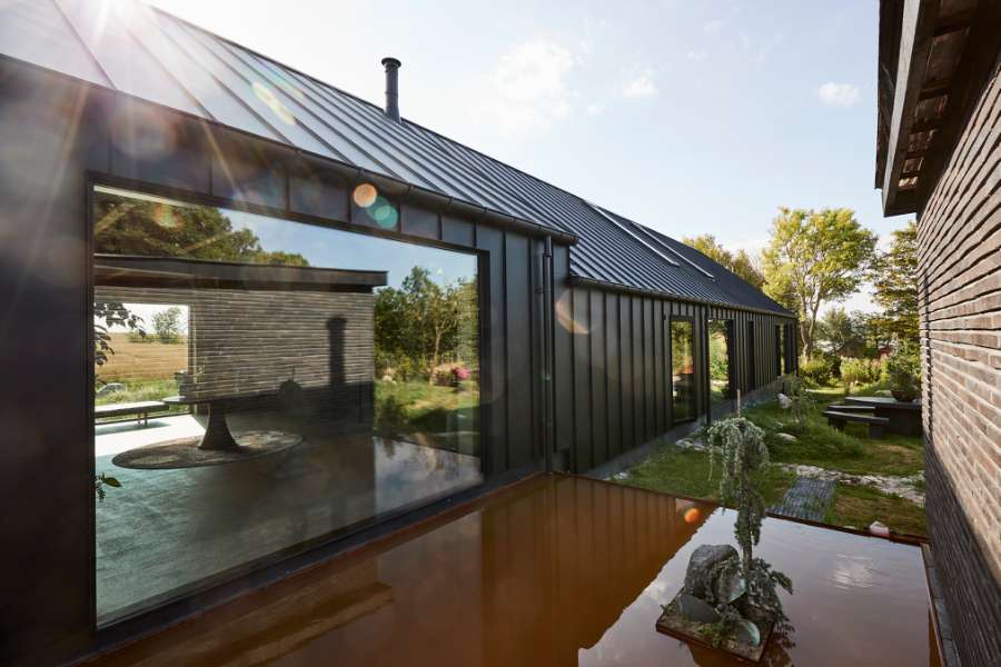 “Royal” door, found in Christiania, now installed in a steel façade, Volstrupvej 63, 9240 Nibe